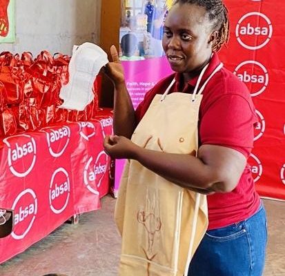 A facilitator for the reproductive health session, Ms. Antoinette Da Rocha, demonstrating the use of some menstrual hygiene products